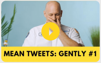 A man in a white shirt with the words mean tweets gently 1.