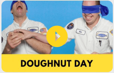 Two men with blindfolds on their faces and the words doughnut day.
